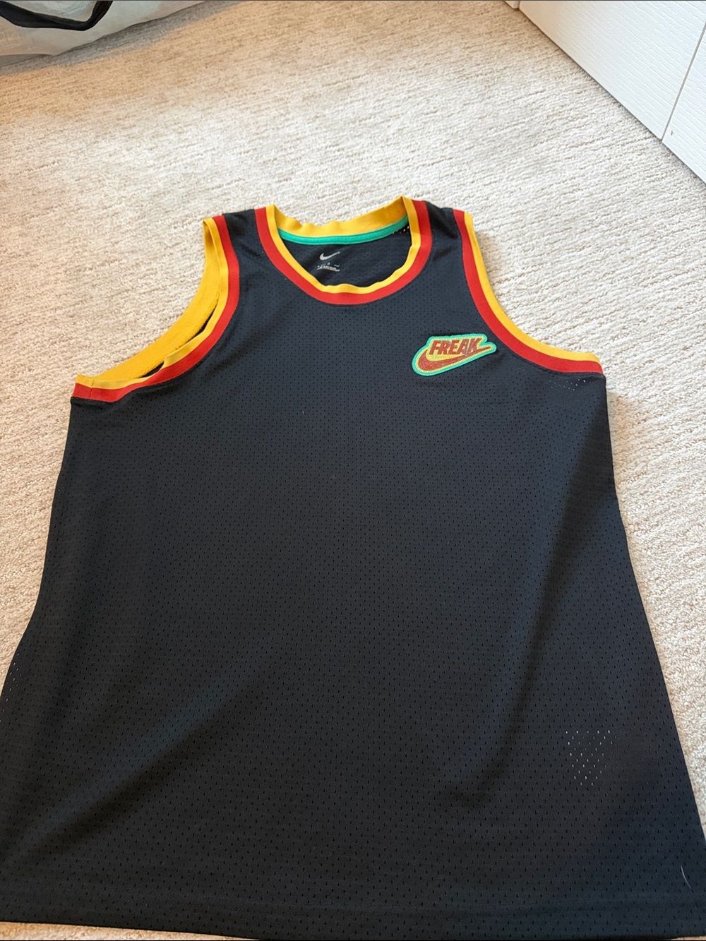 Nike Mens Freak Black Basketball Tank with Red and Yellow Trim